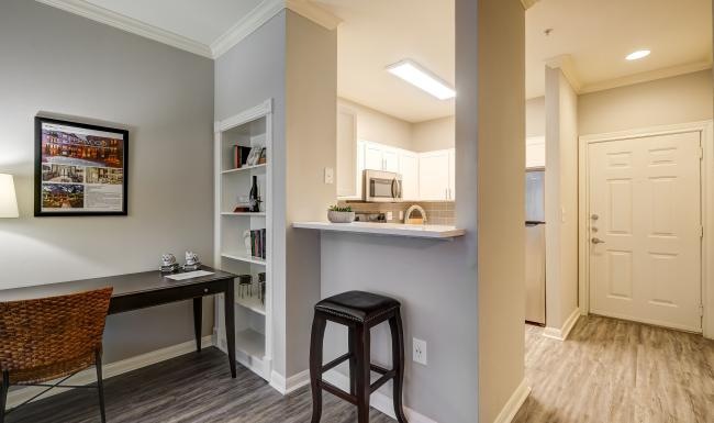 a kitchen with a bar stool
